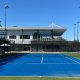 A low angle of one of the courts at the Glen Waverly Sports Hub with a view of the building and Industralight TR Poles