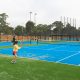 A low angle of one of the courts with children playing at the Glen Waverly Sports Hub and Industralight TR Poles
