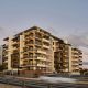 External view of Oran Park Apartments at dusk with Industralight exterior lighting